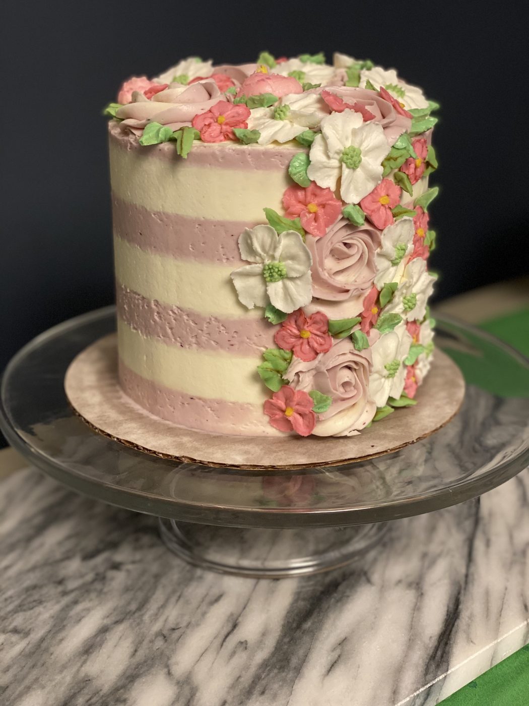 Buttercream cake with cascading sugar flowers